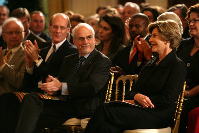 After providing remarks, Mrs. Laura Bush listens from the audience in the East Room of the White House on Oct. 7, 2008, as the 2008 National Medals for Museum and Library Service Ceremony honored five museums and five libraries who have demonstrated outstanding public service.