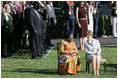Mrs. Laura Bush and Ghana's first lady Theresa Kufuor sit together on the South Lawn of the White House during the South Lawn Arrival Ceremony Monday, Sept. 15, 2008, on the South Lawn of the White House.