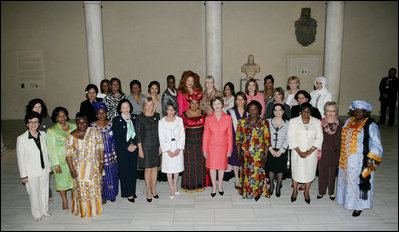 Mrs. Laura Bush, center in salmon-colored suit, hosts 36 other first ladies from around the world at the White House Symposium on Advancing Global Literacy at the Metropolitan Museum of Art in New York City, Sept. 22, 2008. The first ladies were in New York City while their spouses attend the United Nations General Assembly.
