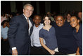 President George W. Bush poses with a group of students Thursday, Jan. 8, 2009, following his address at the General Philip Kearny School in Philadelphia, where President Bush spoke about the success of the No Child Left Behind Act and urged Congress to strenghten and reauthorize the legislation.