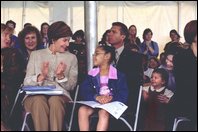 Laura Bush applauds at the end of a reading by renowned children's author and illustrator, Eric Carle, Saturday, October 12, 2002 at the Second Annual National Book Festival on the held on the west side of the Capitol. White House photo by Susan Sterner. 