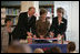 Mrs. Laura Bush participates in a ribbon-cutting Wednesday, June 6, 2007, at the Schwerin City Library in Schwerin, Germany. Joining her are Norbert Claussen, Lord Mayor of Schwerin, and Heidrun Hamann, the Director of the library.