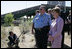 Mrs. Laura Bush surveys the wreckage of the I-35W bridge collapse with Deputy Chief of Police Robert 