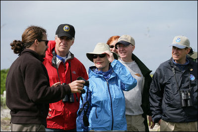Mrs. Laura Bush talks with wildlife biologist, John Klavitter, left, Interior Secretary Dirk Kempthorne and Chairman Jim Connaughton of the Council on Environmental Quality at the Midway Atoll National Wildlife Refuge Thursday, March 1, 2007. The island is home to a great number of endangered species such as Laysan Ducks, Short-tailed Albatross, Hawaiian Monk Seals and Hawaiian Green Sea Turtles. 