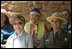 Mrs. Laura Bush and Mesa Verde National Park Superintendent Larry Wiese share a laugh, Thursday, May 23, 2006, during the celebration of the 100th anniversary of Mesa Verde and the Antiquities Act in Mesa Verde, Colorado. Also pictured are members of the Ute Mountain Ute Tribe. White House photo by Shealah Craighead.