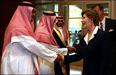 Mrs. Laura Bush is greeted by Mr. Bade Al-Romaih, Guest Relations Manager for the Conference Palace Hotel, upon her arrival for a private lunch Tuesday, Oct. 23, 2007, in Riyadh, Saudi Arabia.
