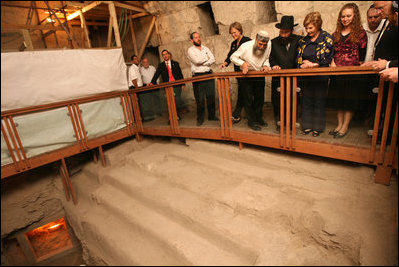 Listening to Mr. Mordechi Eliav as he describes the ongoing construction project that is the Western Wall Tunnels, Mrs. Laura Bush and Mrs. Aliza Olmert, spouse of Israeli Prime Minister Ehud Olmert, participate in a tour of the Jerusalem site, May 14, 2008 