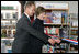 Mrs. Laura Bush participates in a ribbon cutting, assisted by Michael Gawenda, director of the City Library of Stralsund, Thursday, July 13, 2006, at the Stralsund Children's Library in Stralsund, Germany, to open the exhibit America@yourlibrary. The America@yourlibrary is a new initiative to develop existing and new partnerships between German public libraries and the U.S. Embassy and Consulate Resource Centers. 