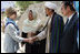 Mrs. Laura Bush meets with local leaders as she arrives June 9, 2008 at the Bamiyan Bazaar in Afghanistan to inaugerate work on the road project.