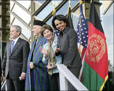 President George W. Bush stands with President Hamid Karzai of Afghanistan, Mrs. Laura Bush and Secretary of State Condoleezza Rice during welcoming ceremonies Wednesday, March 1, 2006, in Kabul.