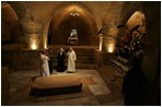 Brother Olivier, prior of the monastery, discusses the historical significance of the Church of the Resurrection at Abu Gosh, during Laura Bush’s visit to the monastery in Israel, May 23, 20005.