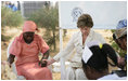 Laura Bush holds hands with patients during a prayer at St. Mary's Hospital in Gwagwalada, Nigeria, Wednesday, Jan. 18, 2006.