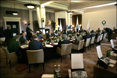 G8 leaders gather around the table for a morning session at the Gleneagles Hotel in Auchterarder, Scotland.  The summit ended Friday, July 8, 2005.
