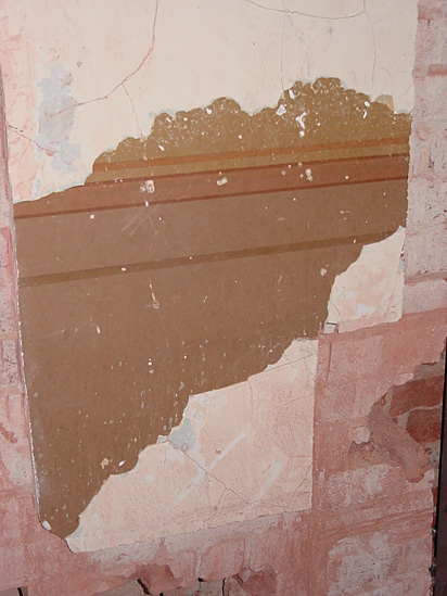 Evidence of the standard office wall finishes from 1888 was found under peeling paint in a third floor office originally for War Department staff.