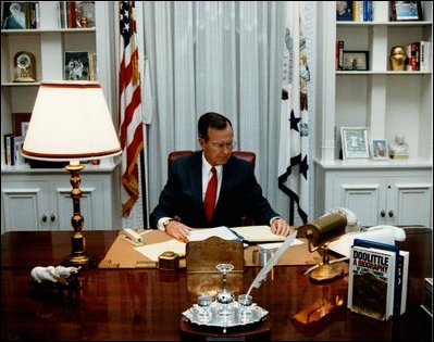 Vice President George H.W. Bush at work in his temporary office in room 180, while restoration work is underway in 1987 in room 274, the Vice President's Ceremonial Office.