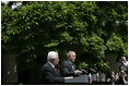 President George W. Bush and President Mahmoud Abbas of the Palestinian Authority, respond to questions during a joint press availability Thursday, May 26, 2005, in the Rose Garden of the White House.