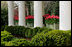A line of boxwood bushes topped by boxes of tulips line the walkway outside the Oval Office, April 11, 2007. White House photo by Ashley Viste 