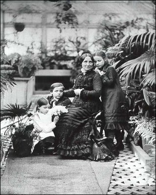 Lucy Hayes poses with her children in the White House conservatories, c.1879.