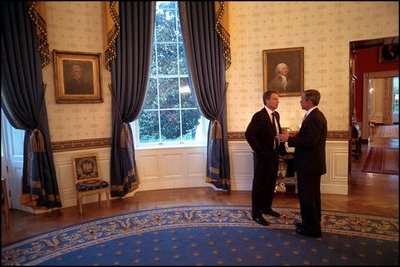 Before delivering his address to Congress and the nation following the attacks of September 11, President George W. Bush speaks with British Prime Minister Tony Blair in the Blue Room, Sept. 20, 2001. 