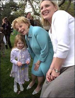 Visiting one-on-one with many families and children, Lynne Cheney poses for pictures on the South Lawn at the White House Easter Egg Roll Monday, April 21, 2003. 