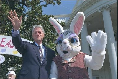 President Clinton poses on stage with the Easter Bunny at the start of the 2000 Easter Egg Roll. The White House Easter Bunny, usually a White House staffer dressed in a special White House rabbit suit, was introduced by Pat Nixon, wife of President Richard Nixon, in 1969.