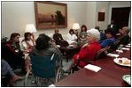 Barbara Bush talks with families of the Iraqi hostages in the Roosevelt Room December 13, 1990.
