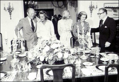 Then-Vice President Nelson Rockefeller (right) and his wife Margaretta Murphy (second on left) entertain then-President Gerald R. Ford (left) his wife Betty (second on right) and their daughter Susan (center) at the Naval Observatory on September 7, 1975. 