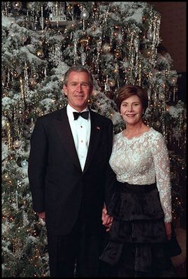 The President and Mrs. Bush stand next to the 2001 tree, an 18-foot Concolor fir that was grown in the mountains of Central Pennsylvania. For ornaments, artists from all 50 states and the District of Columbia designed miniature replicas of historic houses from their regions.