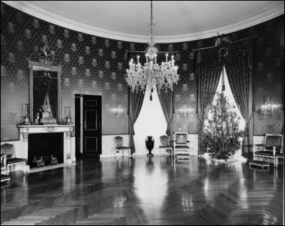 This picture illustrates a Christmas view in the Blue Room during the Herbert Hoover administration.