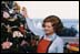 Susan Ford watches her mother decorating their Christmas tree.