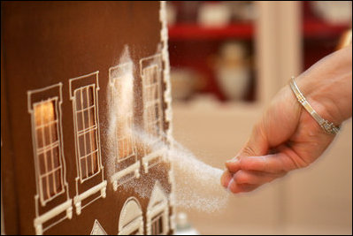 Thaddeus DuBois, Head Pastry Chef, adds finishing touches of sugar to the windows of the official White House gingerbread house.