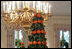 Two topiaries of lemon leaves and tangerines stand tall in the State Dining Room.