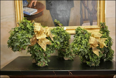 President and Laura Bush’s pooches run along the Ground Floor of the White House residence in topiary form.