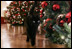 Bush family cat Willie, nicknamed “Kitty,” takes a stroll to visit the Christmas decorations in the East Room of the White House, Wednesday, Nov. 29, 2006.