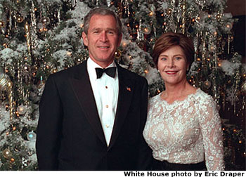Photo of President and First Lady in front of 2001 White House Christmas Tree. White House photo by Eric Draper.