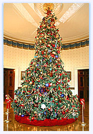 The Official 2004 Christmas tree stands in the center of the Blue Room