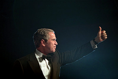 President George W. Bush gives a thumbs-up to the crowd at one of the inaugural balls in Washington D.C., Jan. 20, 2001. 