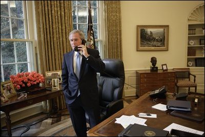 Standing at his desk in the Oval Office, President George W. Bush receives a phone call from Democratic presidential candidate John Kerry in which the senator conceded defeat in the 2004 presidential election Nov. 3, 2004.
