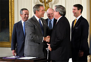 President George W. Bush shakes the hand of Congressman Bill Thomas, R-Calif.