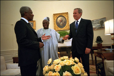 President George W. Bush meets with United Nations Secretary General Kofi Annan, left, and President Olusegun Obasanjo of Nigeria in the Oval Office May 11, 2001. President Bush.s commitment to Africa started long before the announcement of his plan to fight AIDS. He has met with 25 African heads of state and has a wide range of discussions about HIV/AIDS, economy and peace in the region.