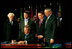 President Bush signs H.R. 1298, The U.S. Leadership Against HIV/AIDS Tuberculosis and Malaria Act of 2003, at the U.S. State Department May 27, 2003. Standing with the President are, from left, Representative Tom Lantos, D-Calif., Senator Bill Frist (R-Tenn., Secretary of Health and Human Services Tommy Thompson and Secretary of State Colin Powell.