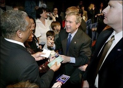 President George W. Bush greets audience members following a discussion on job training and the economy at Mesa Community College in Mesa, Arizona, Wednesday, Jan. 21, 2004.