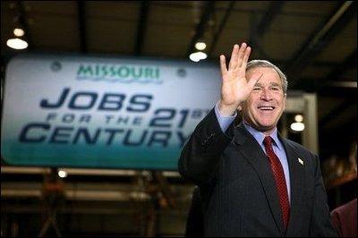 President George W. Bush acknowledges the audience shortly before participating in a conversation on the economy at SRC Automotive in Springfield, Mo., Monday, Feb. 9, 2004.