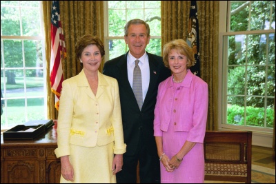 President George W. Bush and Laura Bush congratulate 2003 Do DEA Teacher of the Year Deborah Hadley in the Oval Office Wednesday, April 30, 2003. White House Photo by Eric Draper