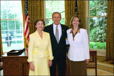 President George W. Bush and Laura Bush congratulate 2003 Maine Teacher of the Year Betsy Ann Wandishin in the Oval Office Wednesday, April 30, 2003. White House Photo by Eric Draper