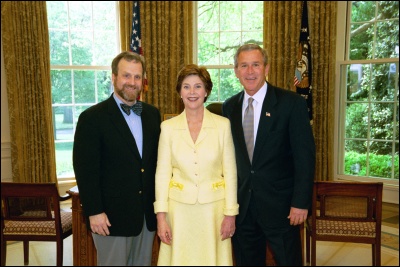 President George W. Bush and Laura Bush congratulate 2003 Maine Teacher of the Year Jeffrey R. Ryan in the Oval Office Wednesday, April 30, 2003. White House Photo by Eric Draper