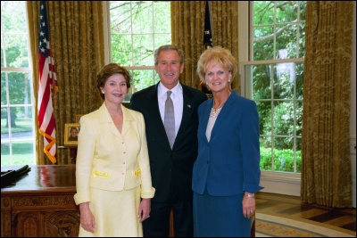 President George W. Bush and Laura Bush congratulate 2003 Maine Teacher of the Year Linda M. McKay in the Oval Office Wednesday, April 30, 2003. White House Photo by Eric Draper