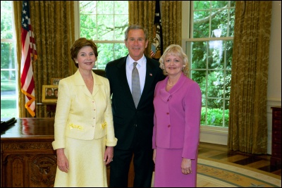President George W. Bush and Laura Bush congratulate 2003 Maine Teacher of the Year Deborah L. Smith in the Oval Office Wednesday, April 30, 2003. White House Photo by Eric Draper