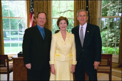 President George W. Bush and Laura Bush congratulate 2003 Maine Teacher of the Year Douglas C. Armstrong in the Oval Office Wednesday, April 30, 2003. White House Photo by Eric Draper