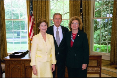 President George W. Bush and Laura Bush congratulate 2003 Maine Teacher of the Year Lorynda Archibeque Sampson in the Oval Office Wednesday, April 30, 2003. White House Photo by Eric Draper